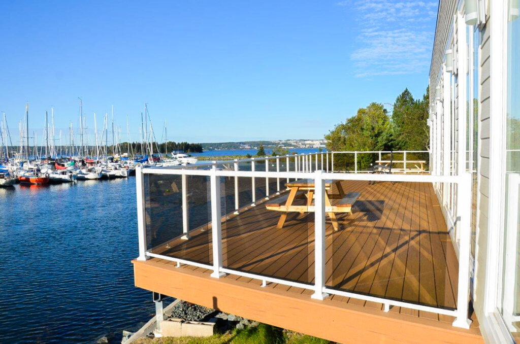 Glass Railing Patio with white aluminum top and bottom rails